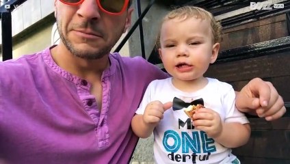 Father tries to teach adorable baby son how to say vowels
