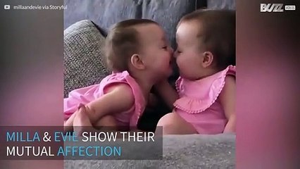 Baby twins' sweet moment caught on camera