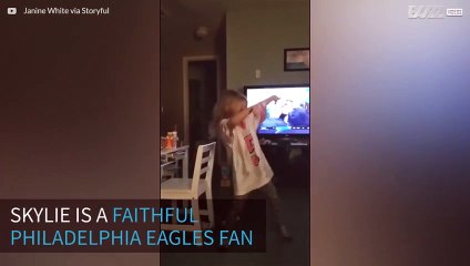 Mini Eagles fan does a victory dance