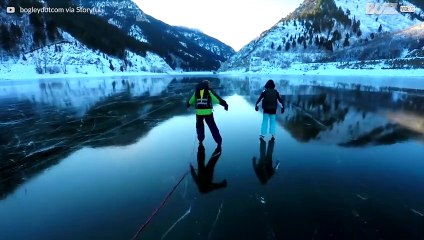 Family ice skates in beautiful landscape