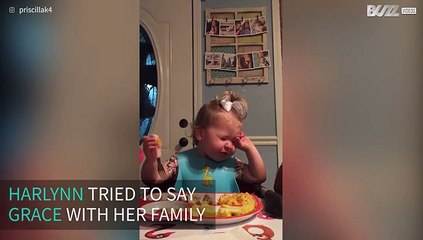 Little girl starts eating before family finishes saying grace