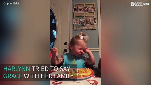 Little girl starts eating before family finishes saying grace