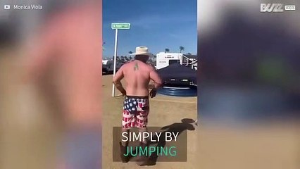 Festivalgoer jumps and breaks bicycle