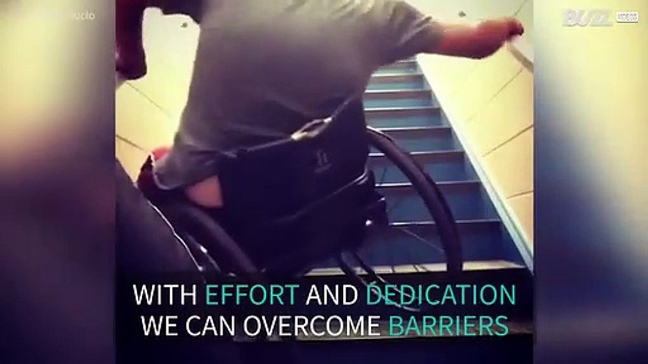 Handicapped athlete climbs up stairs in wheelchair
