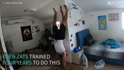 Man sets personal record for a PIN—a one-finger handstand