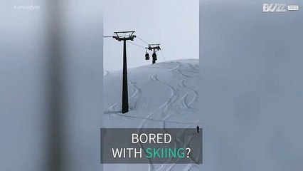 Freeride skier does somersault from ski lift
