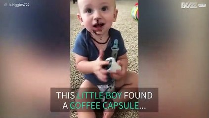 Little boy has great fun using coffee capsule as toy