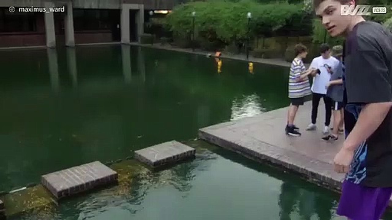 Parkour athlete misjudges leap and gets a soaking