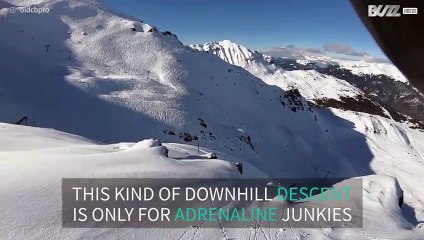Risky and rocky downhill descent on snowboard