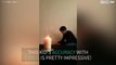 Kid extinguishes candle by throwing cards