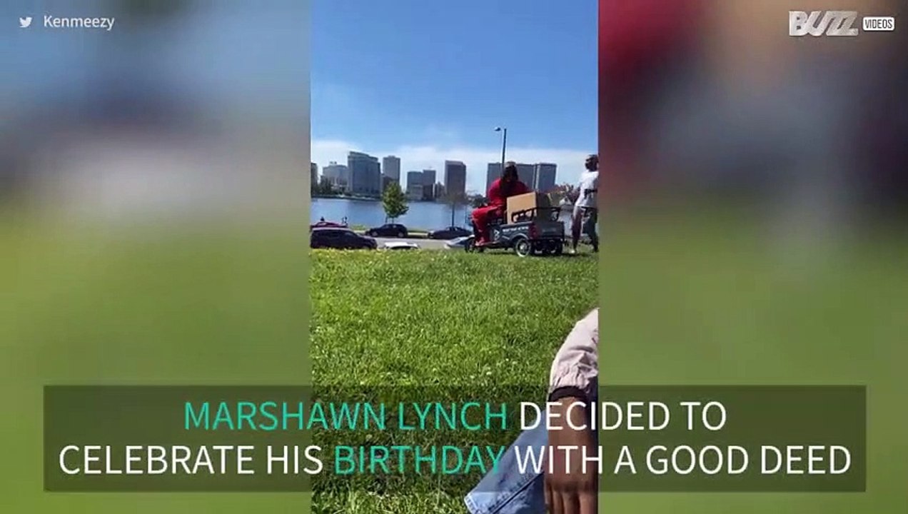 NFL player Marshawn Lynch hands out masks!