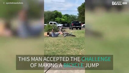 Man fails bicycle jump in style
