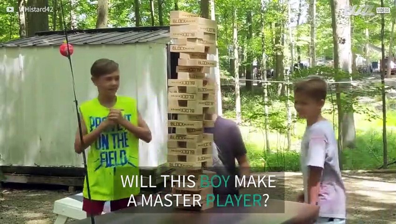 Boy takes giant Jenga blocks in the face