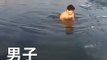 Man swims under ice and misses the hole then his friends rescue him from under the ice
