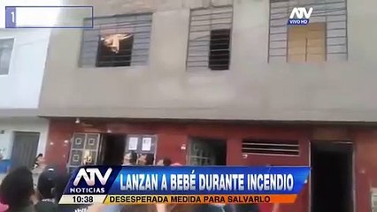 Dramatic moment mother throws her baby from flaming building