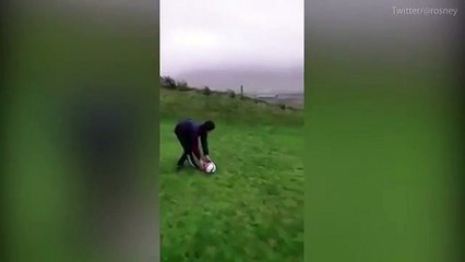 Moment football comes flying back during Storm Eleanor
