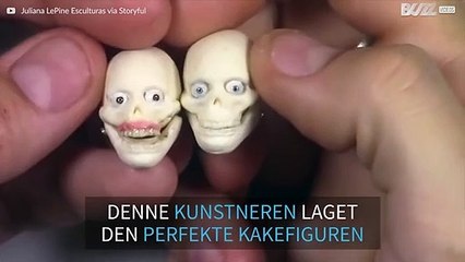 Kunstner lager realistisk skultur av par til bryllupskaken deres