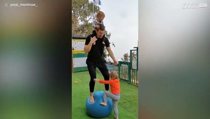 Dad and kids do balance workouts together
