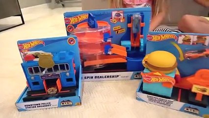 Roma and Diana play with new Hot Wheels cars