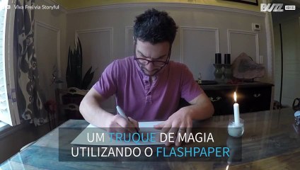 Um truque de magia com um papel e uma vela