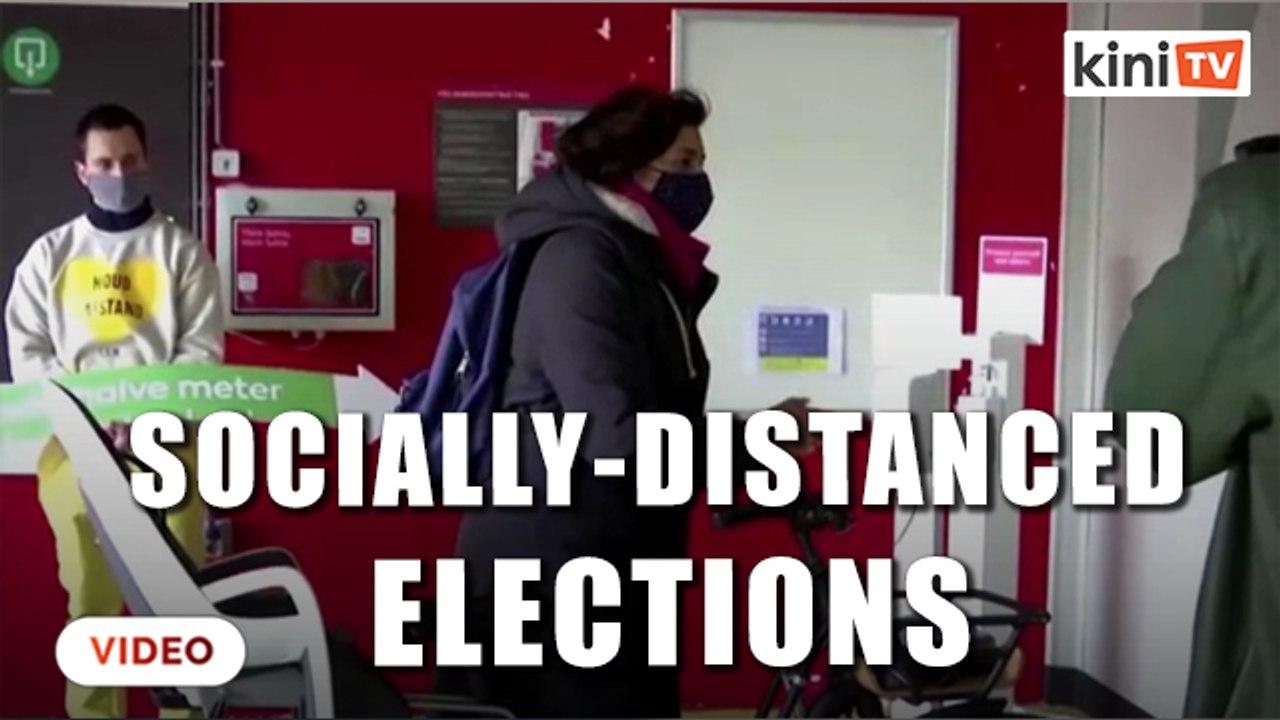 Dutch take to the polls from their cars and bikes