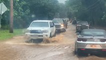 Cars drive through flooded streets in Hawaii