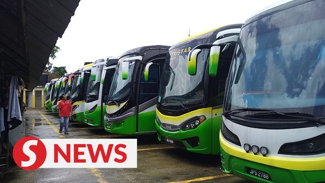 Standing idle at heavy cost for Johor Baru bus and van operators