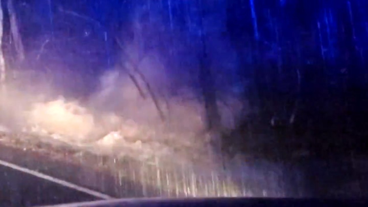 Heavy downpour fuels raging floodwaters