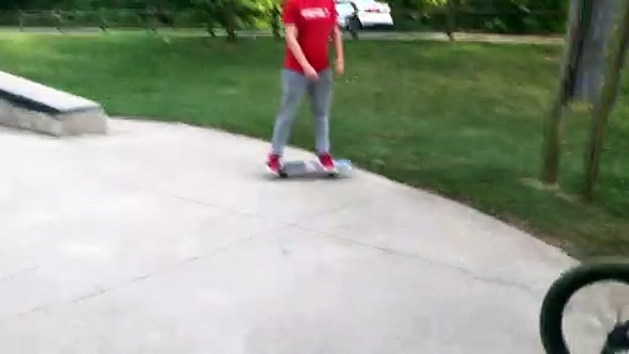 Kid Practicing BMX Goes Over the Handlebars