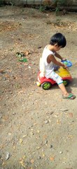Playing with his old little car