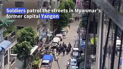 Soldiers patrol Yangon neighbourhood under martial law