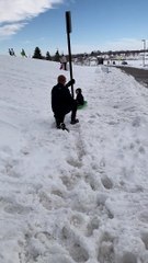 Guy Intercepts Sledding Kiddo from Pole