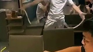 Enthusiastic restaurant worker dances while pulling one-strand noodle in Vietnam