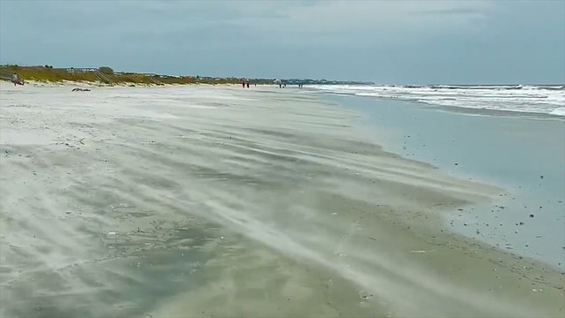 Storm off the east coast brings gusty winds to the Carolinas