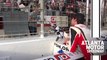 Ryan Blaney hands checkered flag to a young fan after his Atlanta win