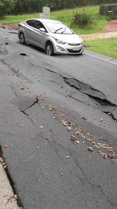 Heavy Rainfall Rips up Street Surface