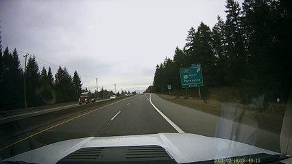 Rogue Trailer Tire Crosses Center Median on Highway