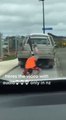 Cyclist on Back of Pickup Truck Faceplants While Attempting to Hop on Street on His Ride