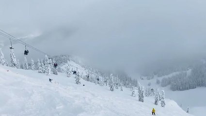 Skiing on a foggy mountain top