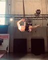 Guy Performs Amazing Aerial Act While Hanging On Straps Attached From Ceiling