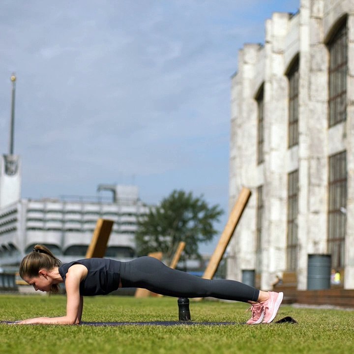 Woman Doing Push-Up And Stretching Exercise