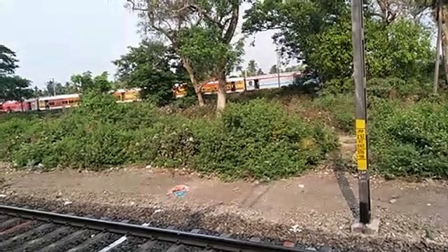 train parrallel race:head to head crossed emu and emu and express train before entering Bandel railway station