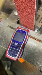 Turning a Nokia 3220 to Dust Using Belt Sander