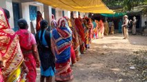 Voters queue outside a polling station in Bengal