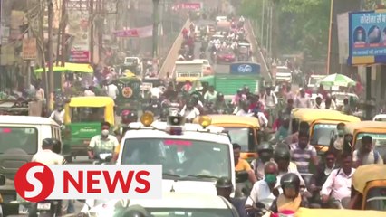 India's daily virus cases breach 100,000