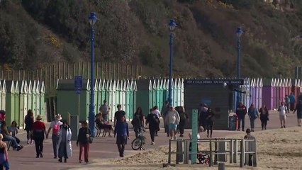 People enjoy the warm weather on Bournemouth beach