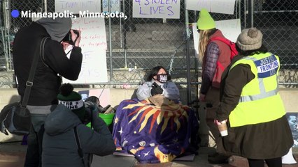 Activist chains herself outside US court during Derek Chauvin trial