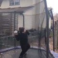 Kid Stands On Trampoline And Performs Roof To Basket Trickshot With Ball