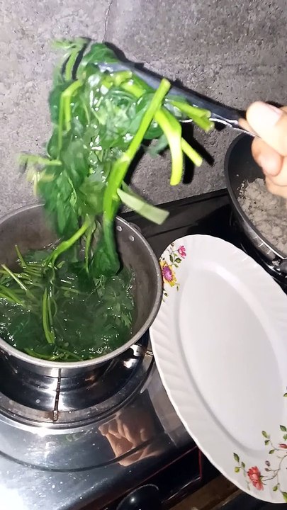 cooking camote leaves