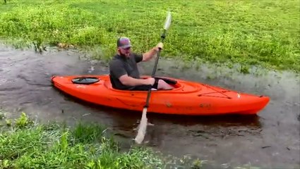 Kayaking in the...flooded backyard?